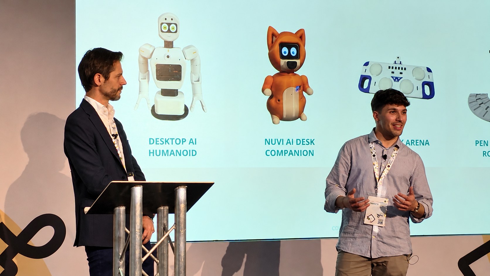 Luca on stage at an Arduino conference, presenting his robots built with Arduino UNO Q and VENTUNO Q