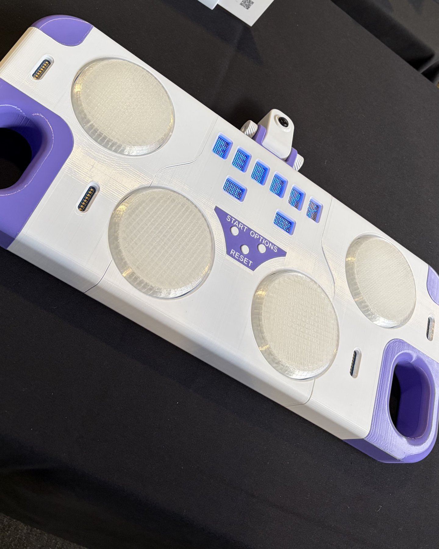The machine on display at an Arduino event: the four pads, the LED timer and the camera